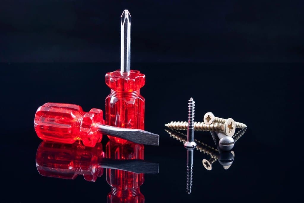 Screwdrivers and screws ready for a repair
