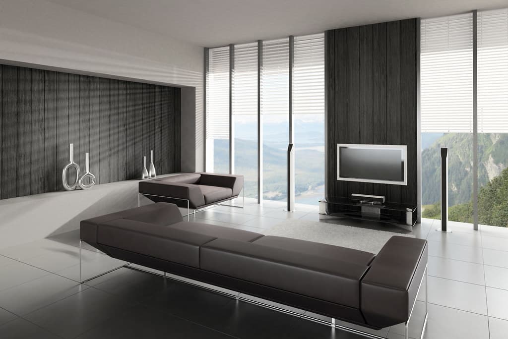 Modern living room with a dark textured feature wall behind a wall-mounted TV